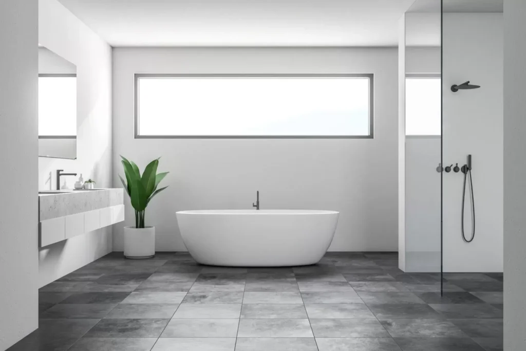 Modern bathroom with a freestanding tub, walk-in shower and tiled floor